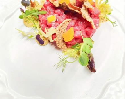 Podolico beef tartare on dried chickpeas with crusco pepper, orange supreme and mustard mayonnaise